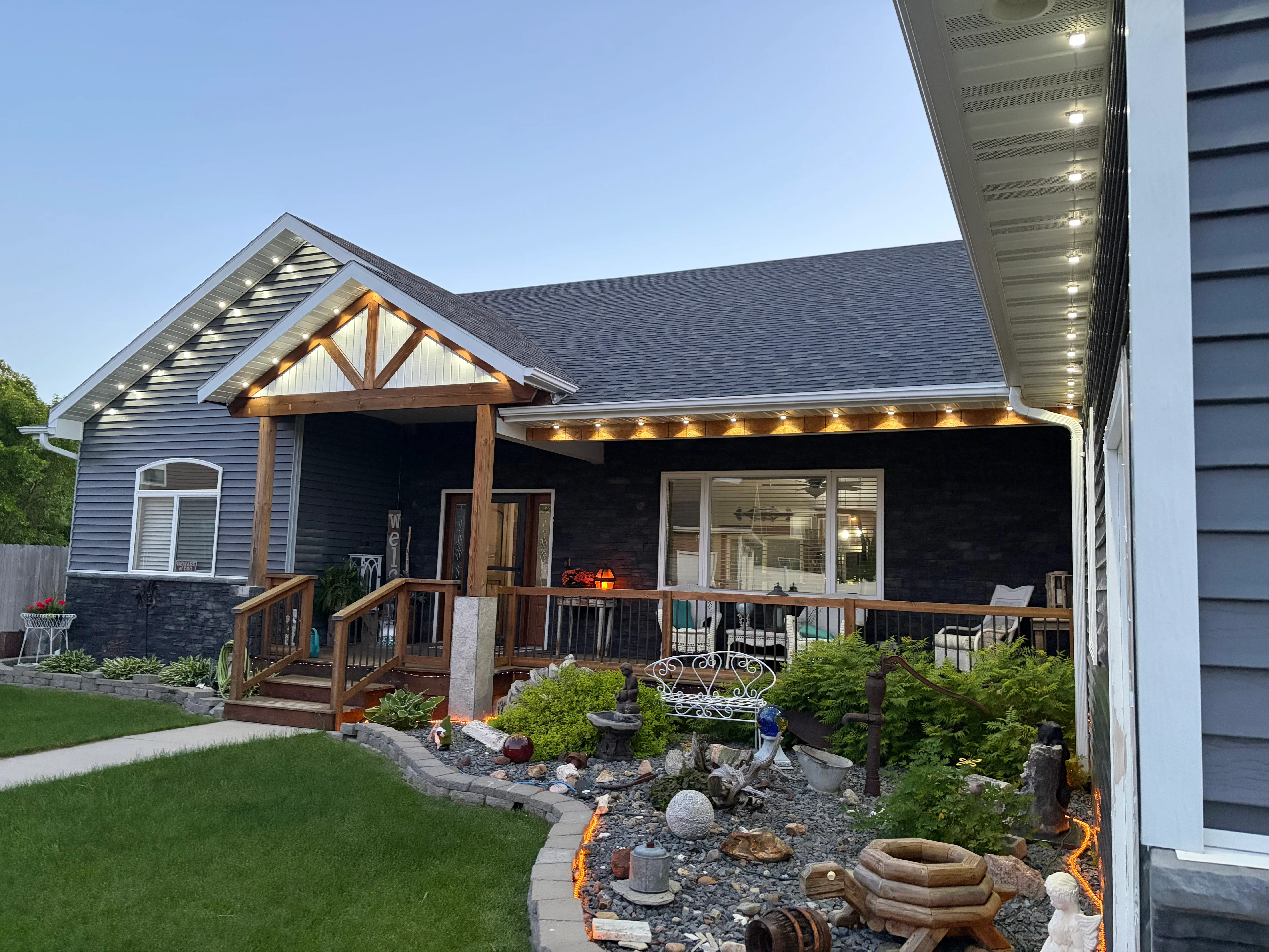 Recessed LED soffit lights installed under covered patio roof with wood beam accents